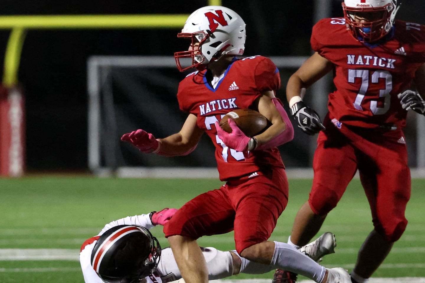 Natick's Jack Showstead attempts to elude Wellesley defender Jake Broggi (7) in the first half of Friday's Bay State Conference matchup.