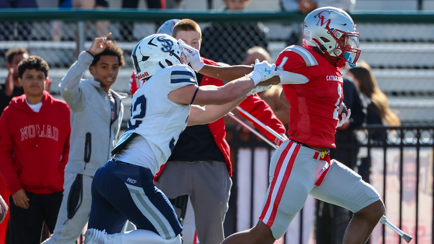 Catholic Memorial senior Mekhi Dodd (1) created separation from St. John's Prep defender Jackson Tucker (32) en route to his 64-yard first-half rush.