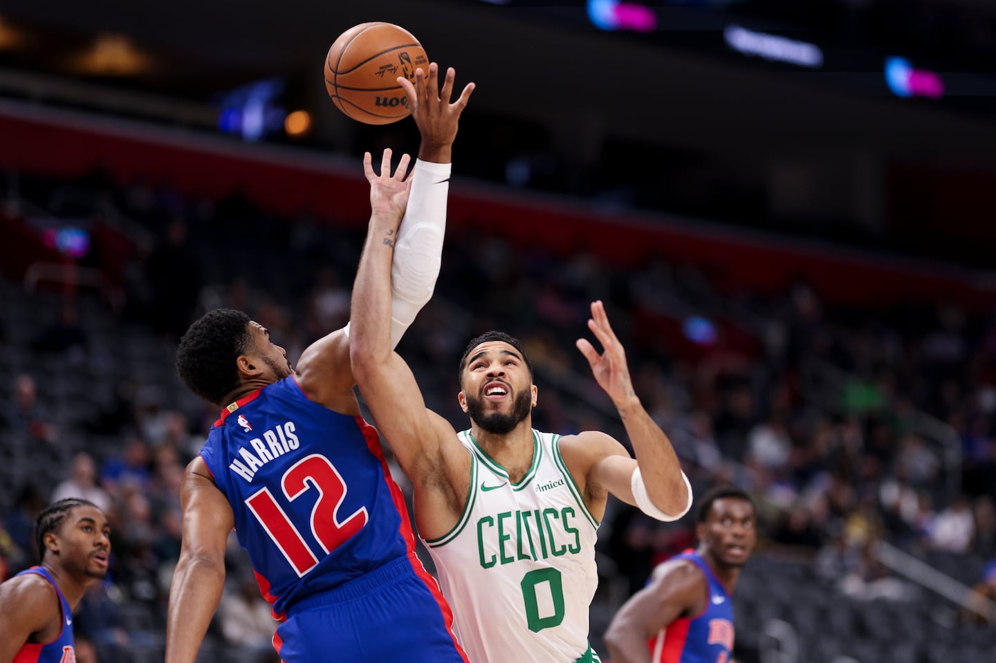 Jayson Tatum shoots the ball as he is fouled by Tobias Harris in the first quarter of a game in Detroit.