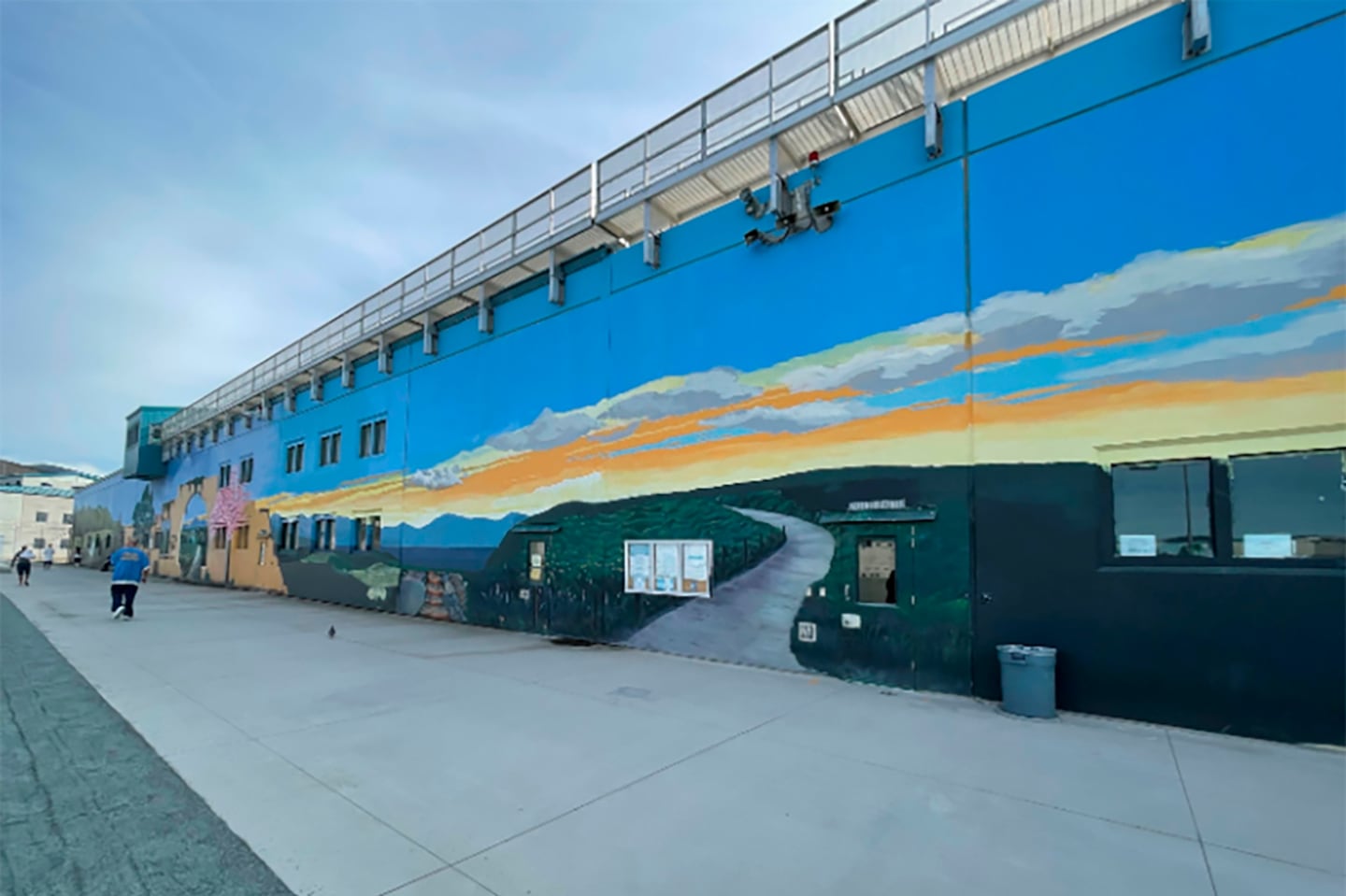 This undated image provided by California Department of Corrections and Rehabilitation showed a mural inside the prison yard at the Richard J. Donovan Correctional Facility in San Diego, where Lyle and Erik Menendez launched a beatification program in 2018. 