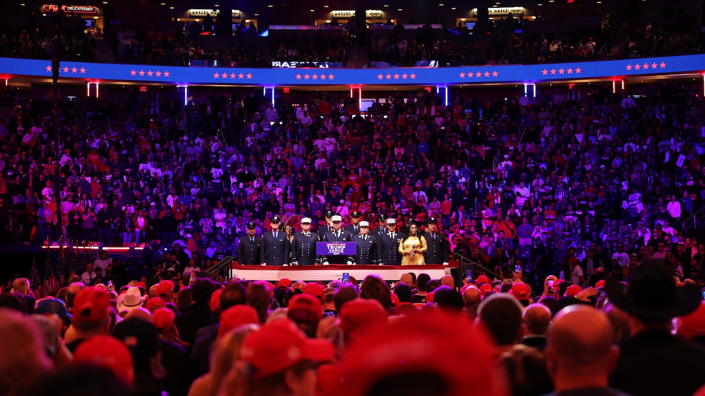 Ret. 9/11 members of the FDNY and singer Mary Millben sing the National Anthem prior to Republican presidential nominee, former U.S. President Donald Trump taking the stage at a campaign rally at Madison Square Garden on Oct. 27 in New York City.