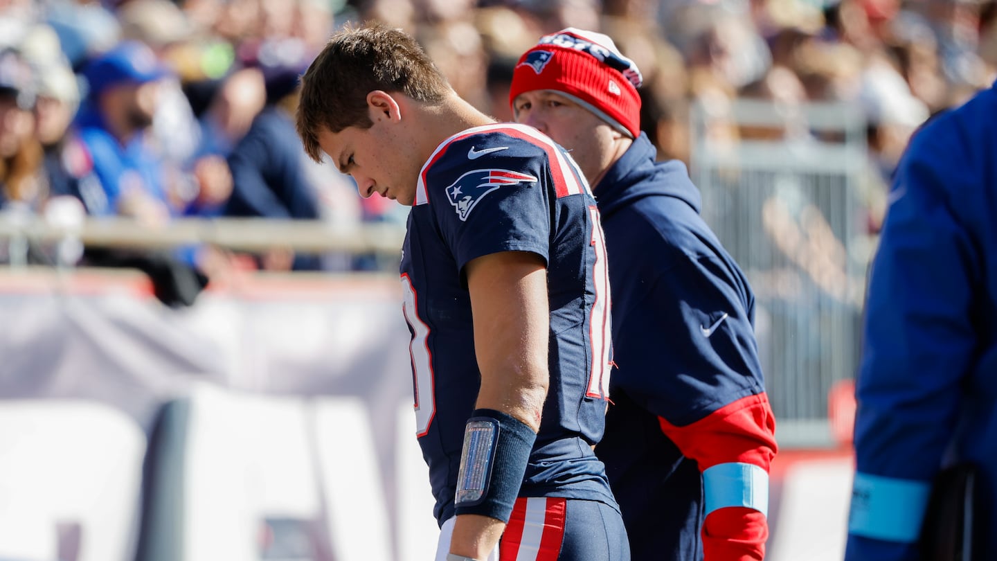 Rookie quarterback Drake Maye headed to the locker room in the first half of Sunday's game.