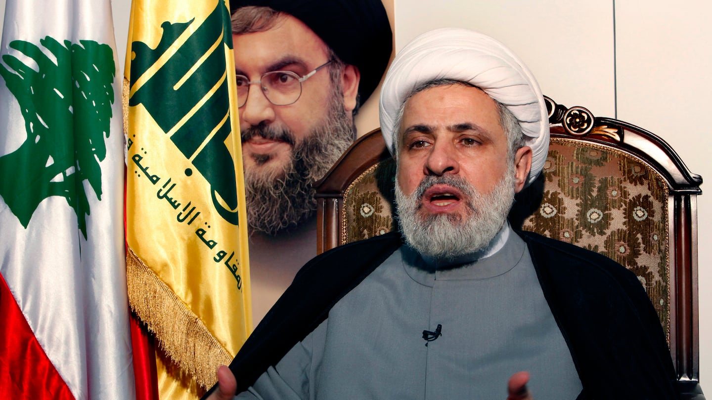 The newly named leader of Hezbollah, Sheik Naim Kassem, speaks during an interview with the Associated Press in the southern suburb of Beirut, Lebanon, Tuesday June 2, 2009.