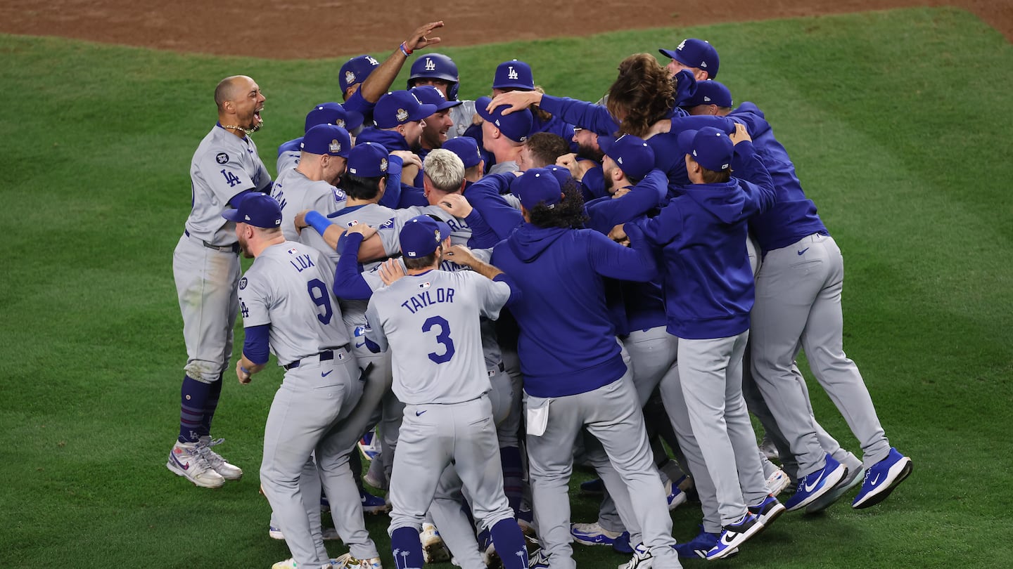 Mookie Betts (left) celebrated a second World Series title with his Dodgers, this time with the party starting on the Yankee Stadium infield.