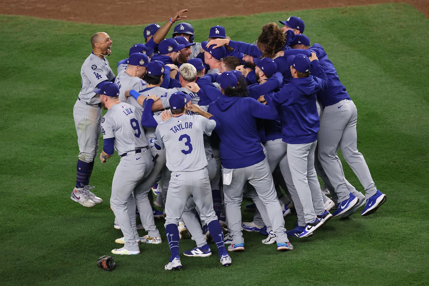 Mookie Betts (left) celebrated a second World Series title with his Dodgers, this time with the party starting on the Yankee Stadium infield.