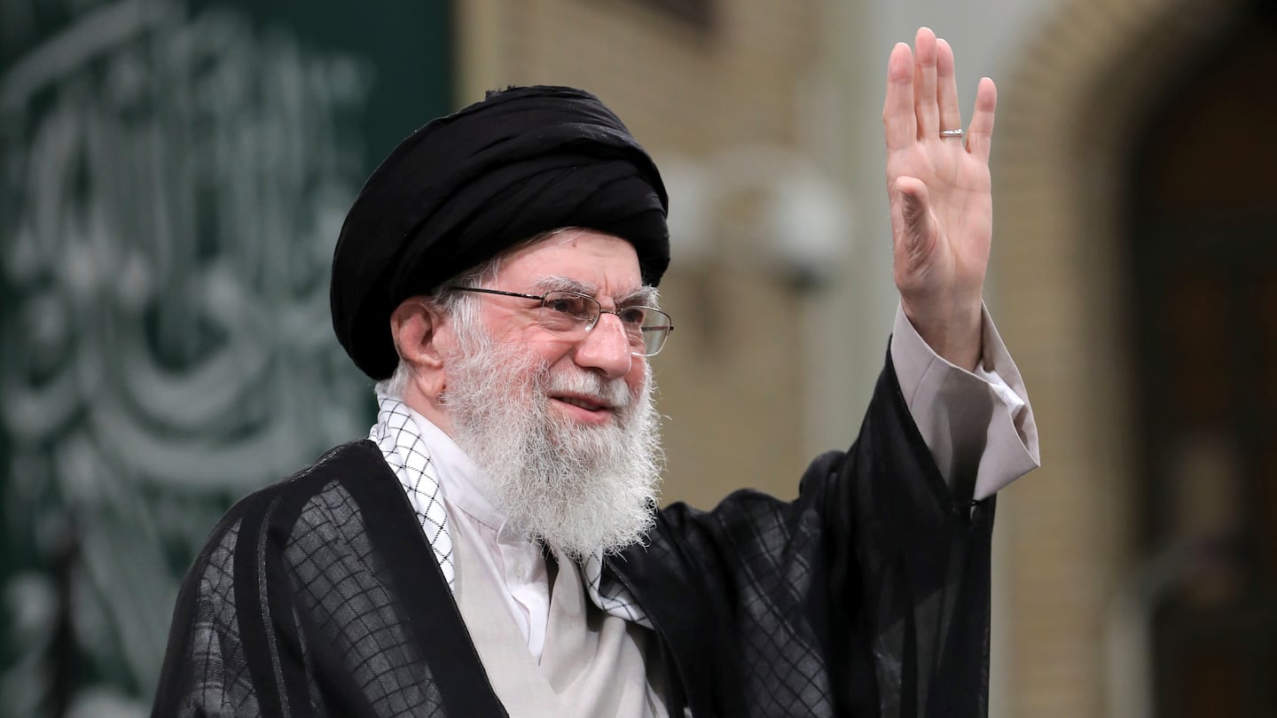 In this photo released by an official website of the office of the Iranian supreme leader, Supreme Leader Ayatollah Ali Khamenei waves to the crowd during a meeting with school and university students, in Tehran, Iran, on Nov. 2.