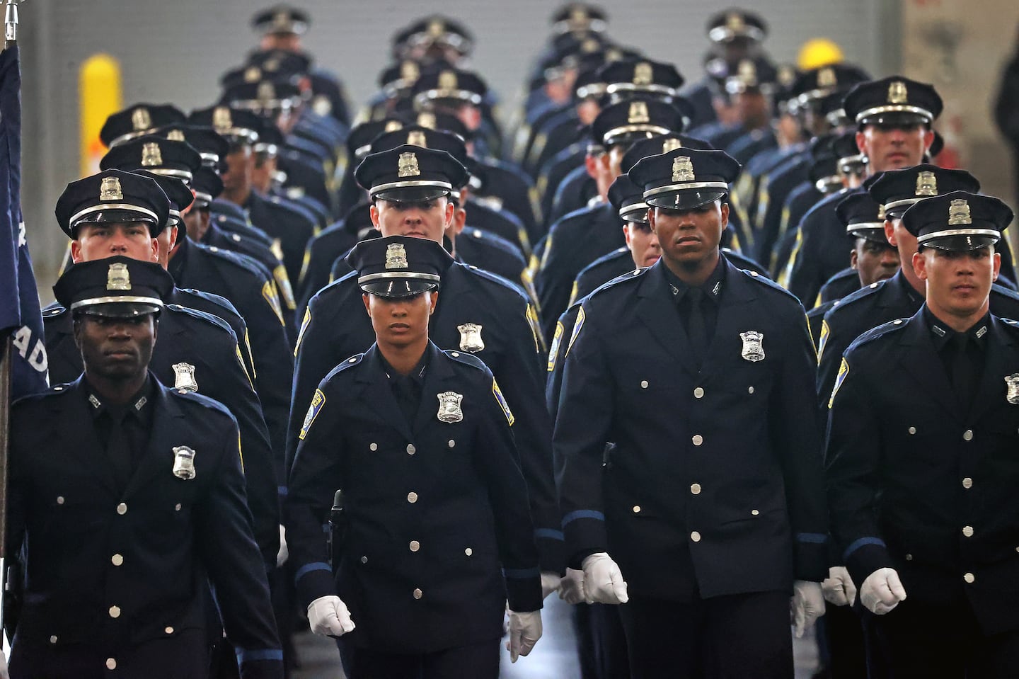 Members of Boston Police Academy's latest recruiting class marched into the Boston Convention & Exhibition Center Friday morning for a swearing in ceremony.