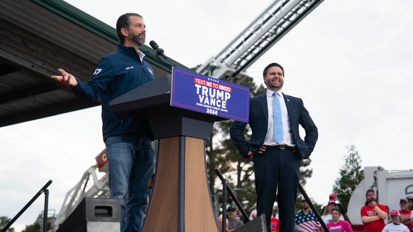 Republican vice presidential nominee, Ohio Senator JD Vance, looked on as Donald Trump Jr. spoke at a campaign rally Friday in Selma, N.C.