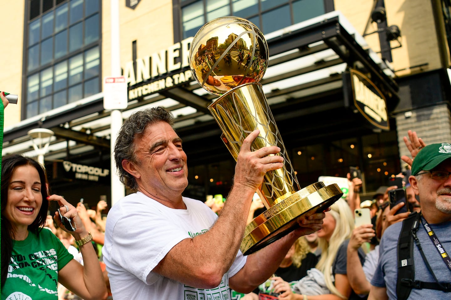 Owner Wyc Grousbeck of the Boston Celtics held the Larry O'Brien Championship Trophy during the 2024 Boston Celtics championship parade following their 2024 NBA Finals win on June 21 in Boston.