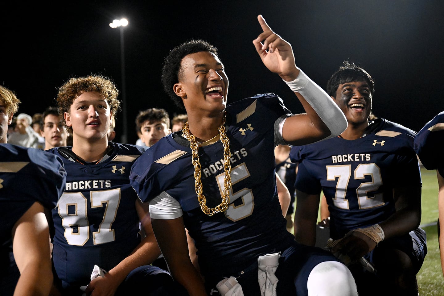 Aidan Williams (center) and Needham earned the No. 4 seed in Division 1 after an 8-0 regular season.