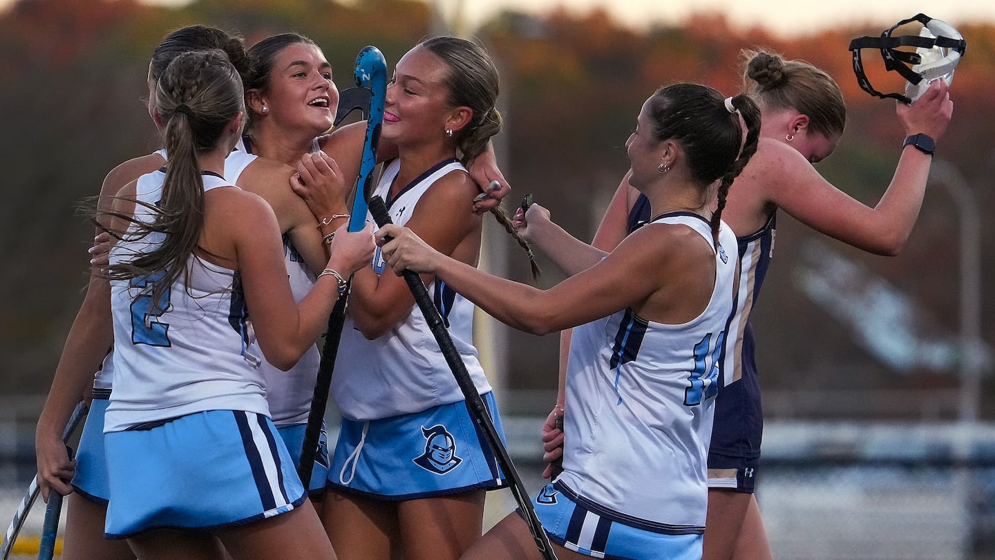 Sandwich’s Khloe Schultz (1), celebrates with her teammates after scoring the first of her three goals as the top-seeded Blue Knights cruised to a 2-0 second-round win over Foxborough.