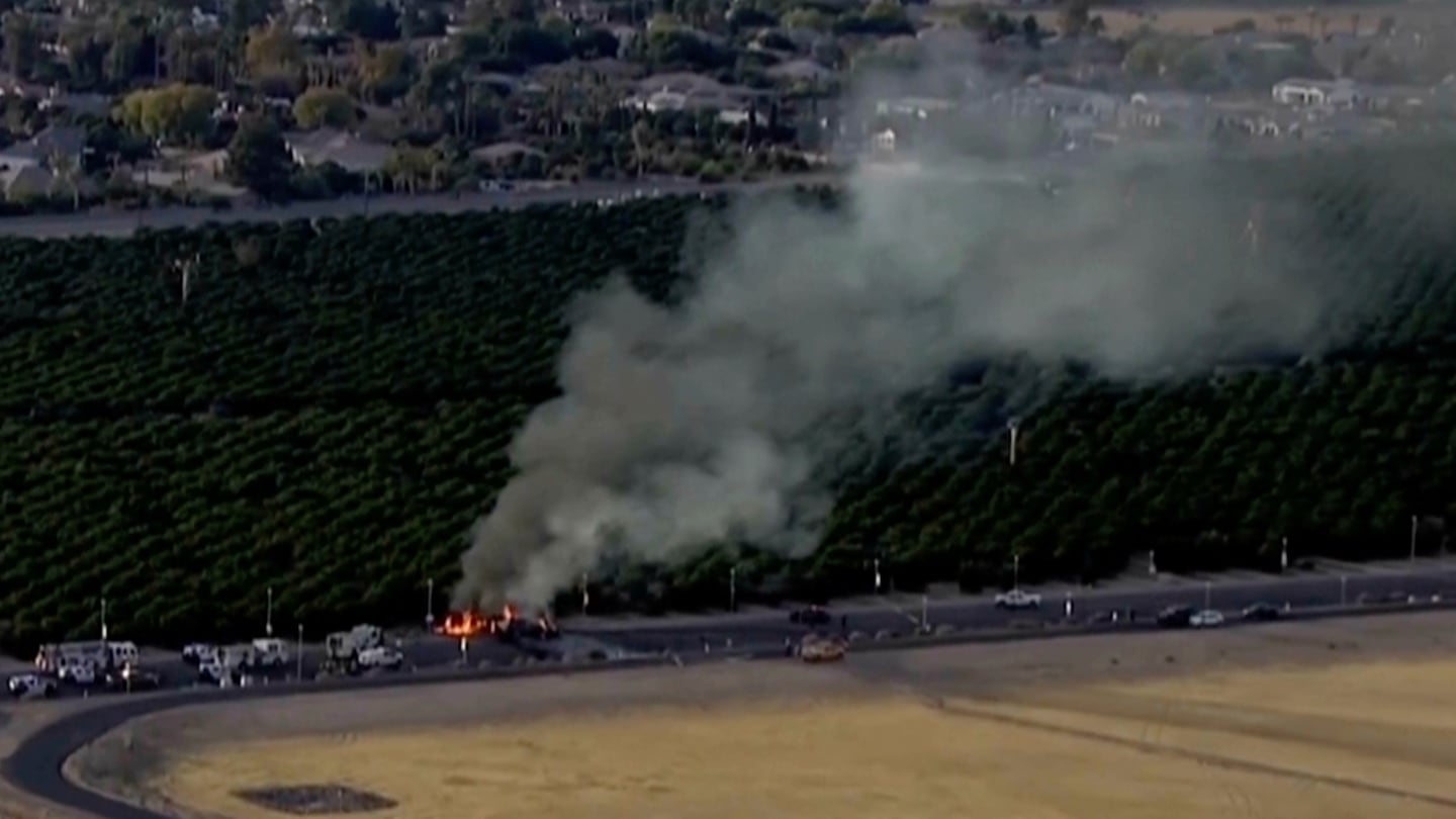 Smoke rising from a deadly plane crash, Nov. 5, in Mesa, Ariz.