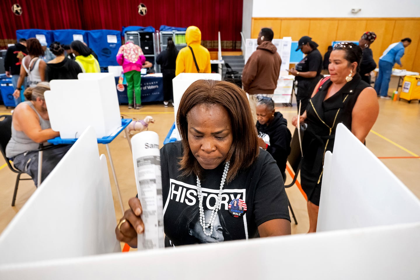 Sheron Campbell wears a Kamala Harris shirt while voting on Election Day in Oakland, Calif., Tuesday, Nov. 5, 2024.