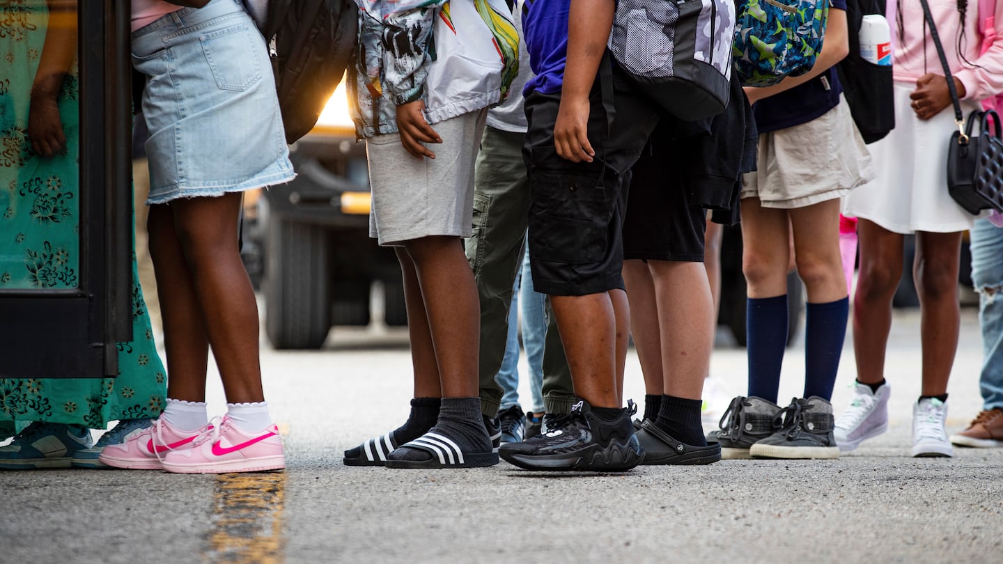 Jefferson County Public School students lined up to switch buses at the JCPS Detrick Bus Compound on the first day of school on, Aug. 9, 2023 in Louisville, Ky. In Kentucky, supporters rallied in favor of a proposal to fund private and charter schools with public money. It did not pass.