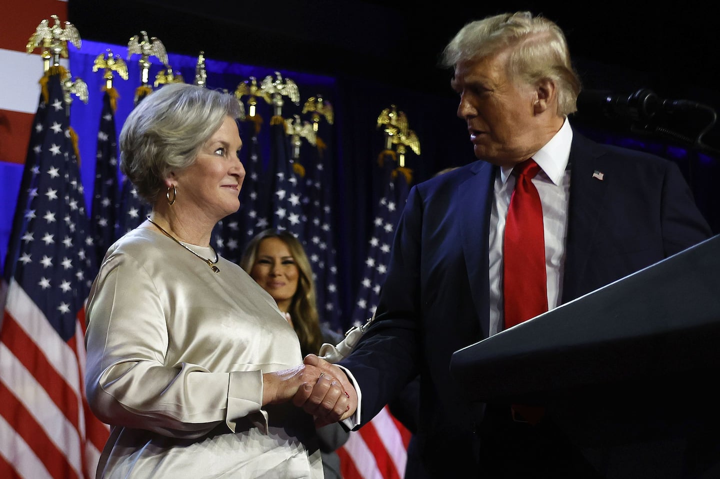 Republican presidential nominee former President Donald Trump brings Susie Wiles to the podium at an election night watch party Wednesday, Nov. 6, 2024, in West Palm Beach, Fla.