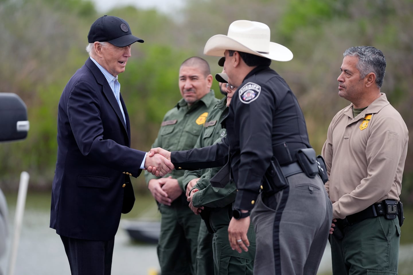 President Biden talks with the US Border Patrol and local officials, as he looks over the southern border, Feb. 29, in Brownsville, Texas, along the Rio Grande.