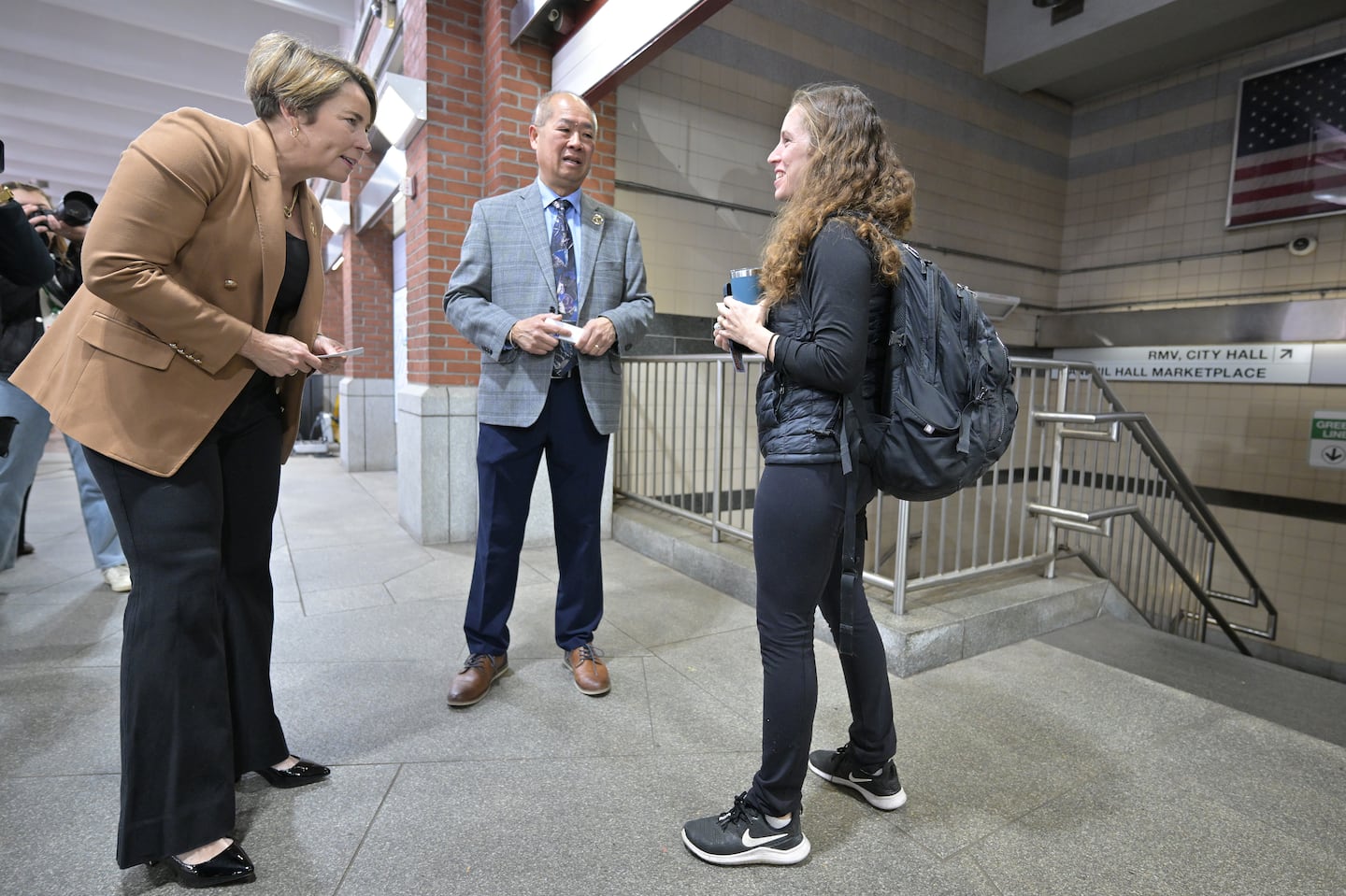 From left, Governor Maura Healey and MBTA General Manager Phil Eng met with commuter Ilaria Cat of Jamaica Plain, during a visit to Haymarket Station.