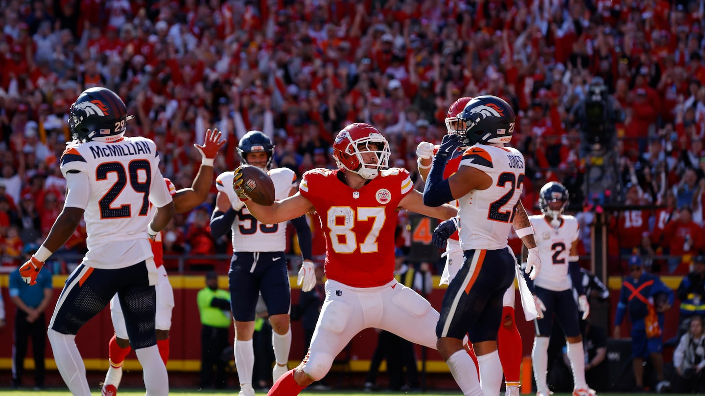 Chiefs tight end Travis Kelce spiked the ball after catching a touchdown pass in the second quarter against the Broncos.