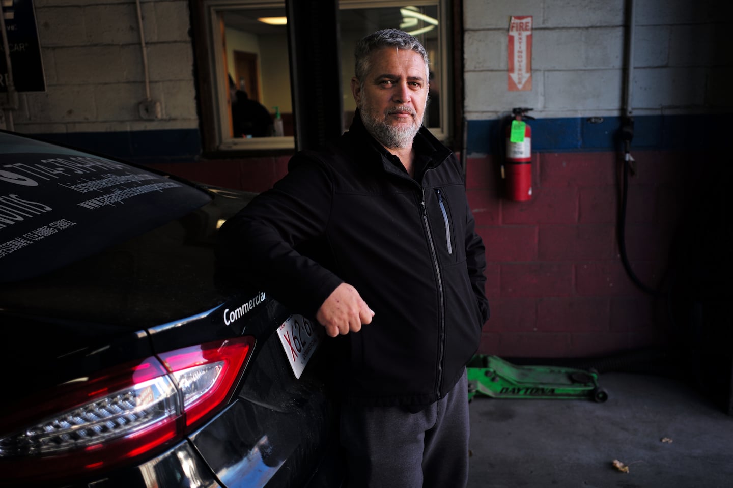 Jefferson Moises poses for a portrait at One Stop Auto Center in Fall River. Moises was among the voters who helped lift Donald Trump to victory in the South Coast city.