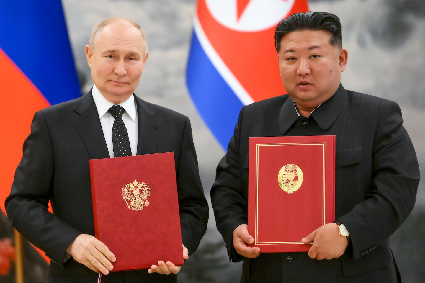 Russian President Vladimir Putin, left, and North Korea's leader Kim Jong Un during a signing ceremony of the new partnership in Pyongyang, North Korea, on June 19.