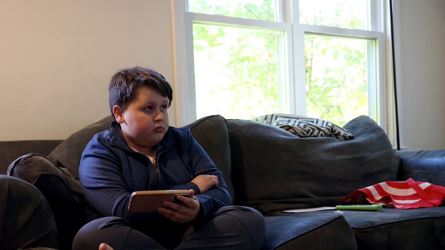 Will Lambert, 10, played on his mother’s phone after school as he sat in the family’s living room. Will has autism and is sweet natured with his family's cat. But he can become agitated and turn violent. His parents believe he needs to be placed at a special school to help him cope with his disability so he doesn't hurt himself or others, but his school district disagrees. The Lamberts can't afford an attorney to advocate on their behalf.
