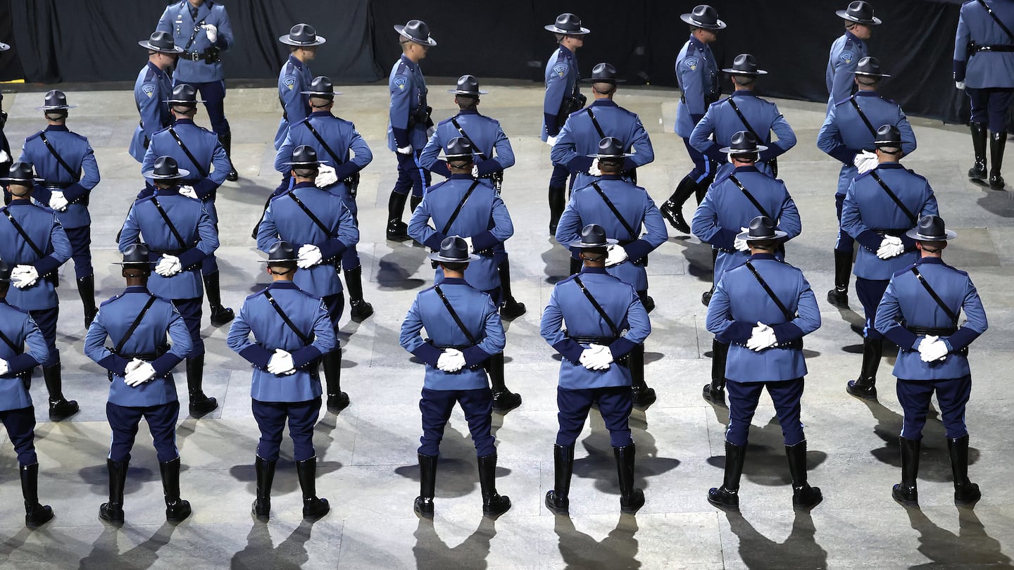 At the DCU Center in Worcester, State Police Academy graduates were in line to get their badges. Thirty-five percent of the original 284 recruits who were accepted into the program failed to graduate.