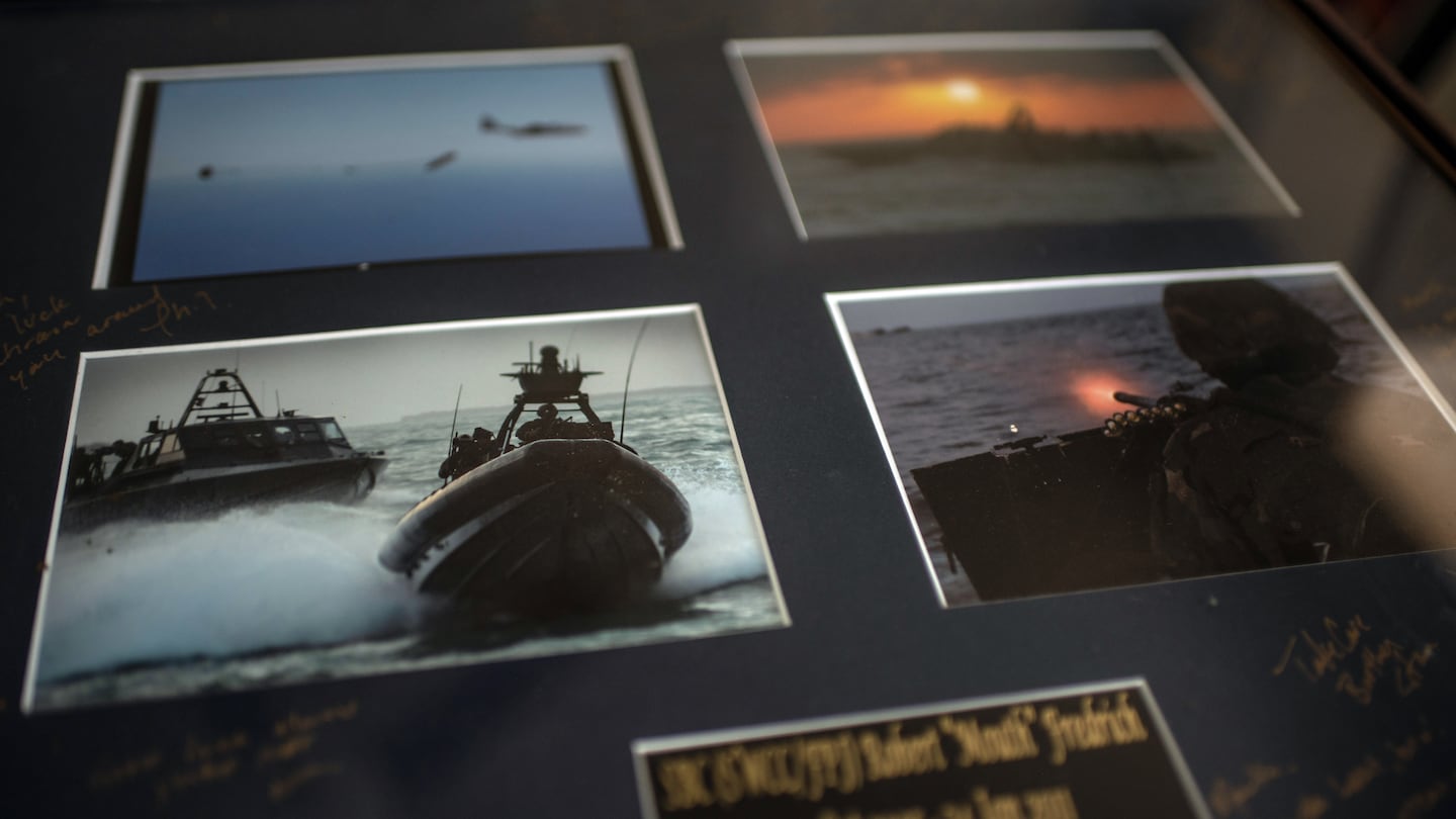 Robert Fredrich, a retired senior chief who served in the Navy's Special Boat Teams from 2001 to 2023, displayed photos from his time in the Navy.