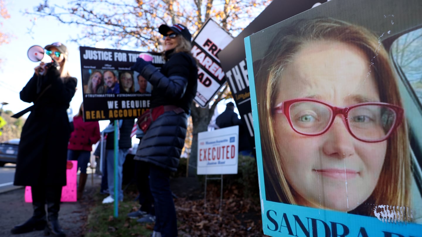 A photo of Sandra Birchmore was seen on a banner during a Stronger Together Standout where the groups Free Karen Read, Justice for Sandra Birchmore & Justice for Juston Root protested together outside of the Norfolk District Attorney's office.