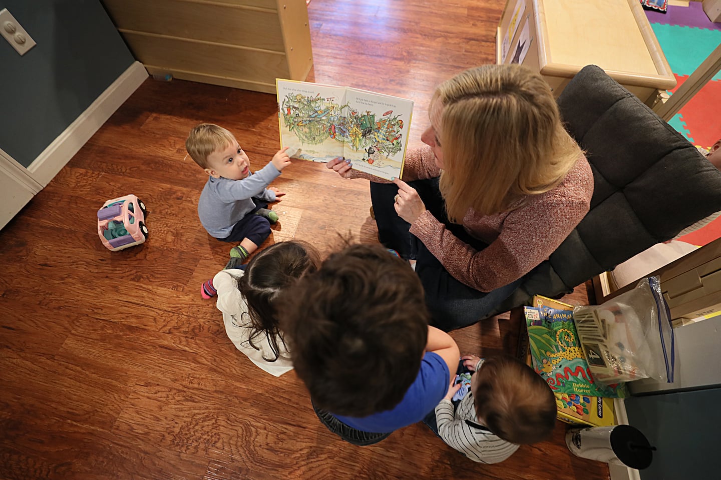 Jennifer Simpson read to children at her home day care, Brilliant Beginnings Daycare. Lawmakers are expected to pass a proposal that would allow political candidates to spend their campaign funds on child care, something at least 30 other states allow.