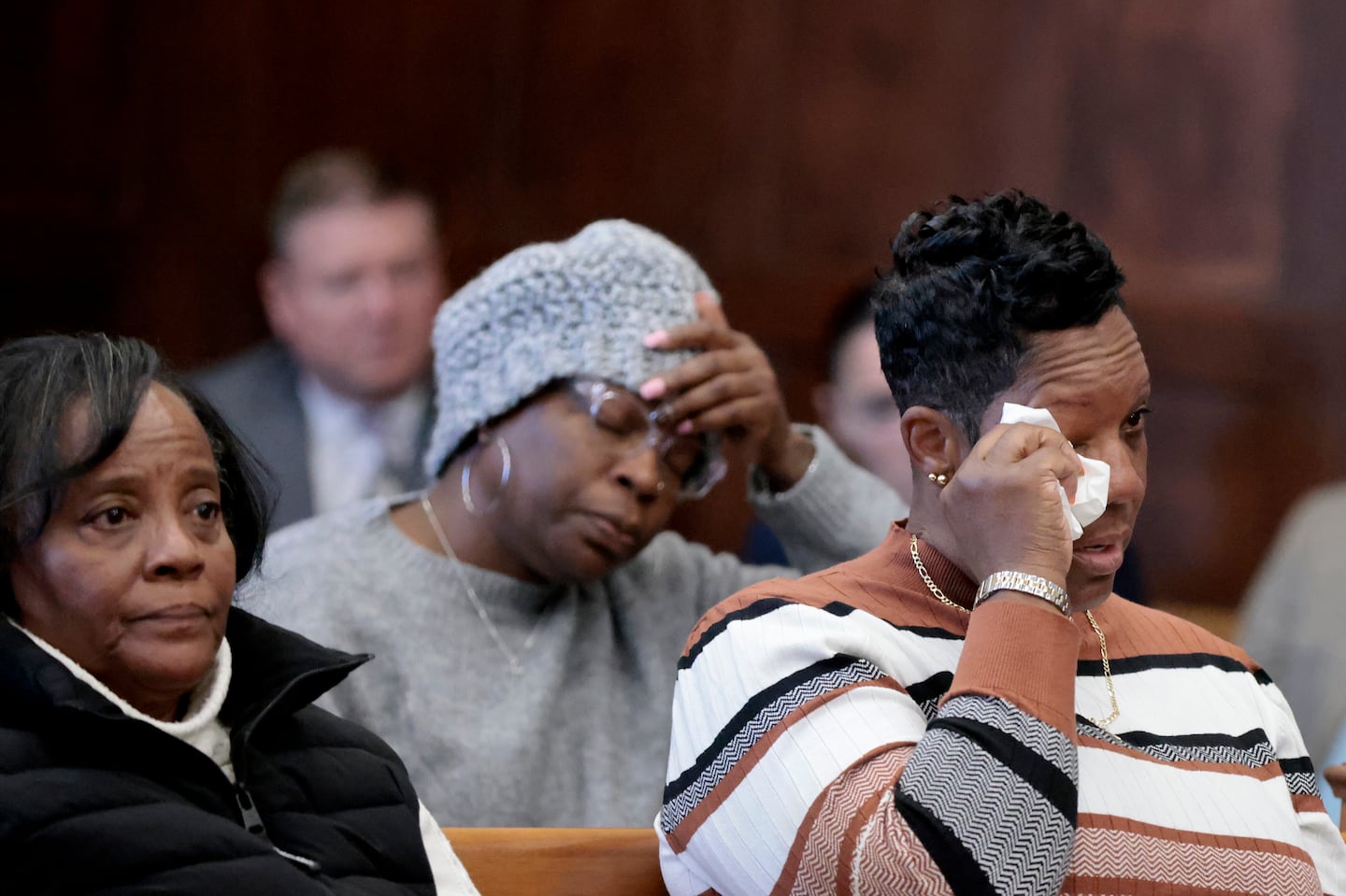 Lenise Young wiped tears after giving an impact statement for her nephew and victim Curtis Ashford Jr.  The victim’s grandmother Deborah Rogers-Robinson is left, another aunt Jannine Jenkins  is center.  