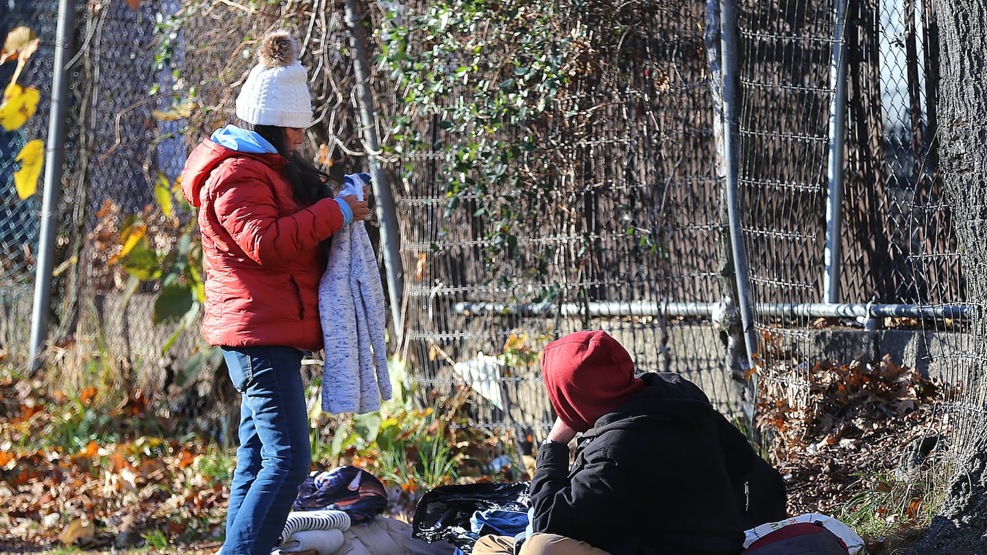 People gathered at Perkins Park on North Main Street in Brockton on Tuesday, a popular location for homeless to set up encampments. A new Brockton law bans the homeless from camping on public property.