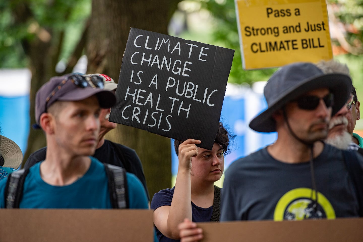 Climate activists rallied on Boston Common before marching to the State House in Boston in July.