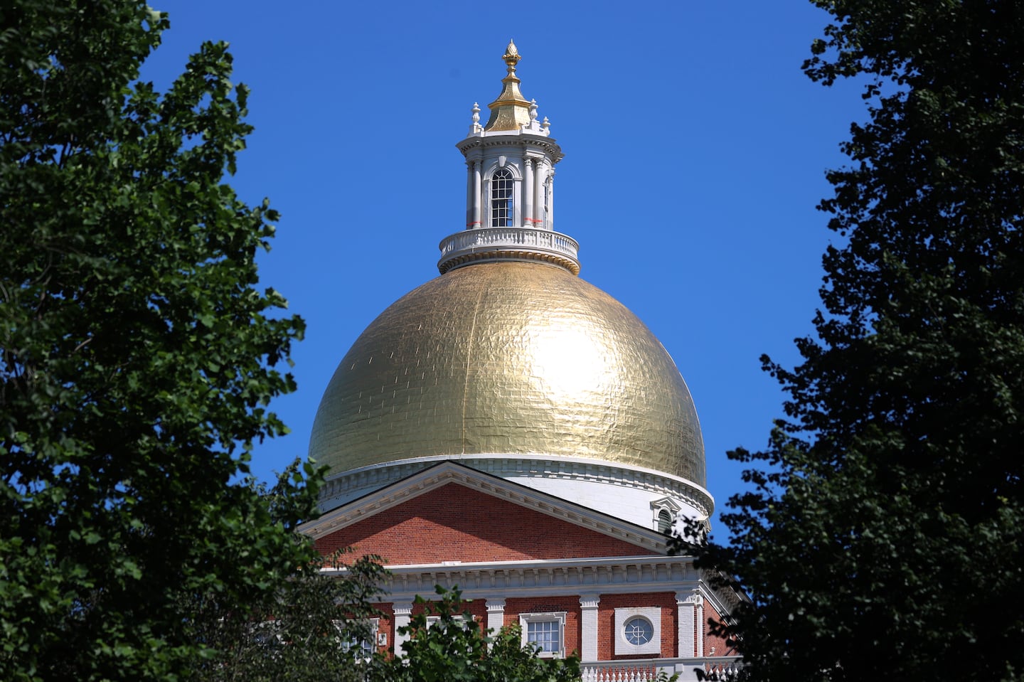 The Massachusetts State House golden dome and cupola.