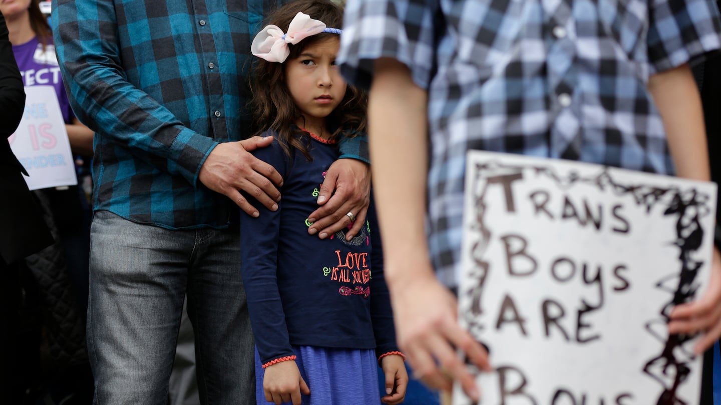 Libby Gonzales stands with her father, Frank Gonzales, as she joins other members of the transgender community during a rally on the steps of the Texas Capitol, March 6, 2017, in Austin, Texas.