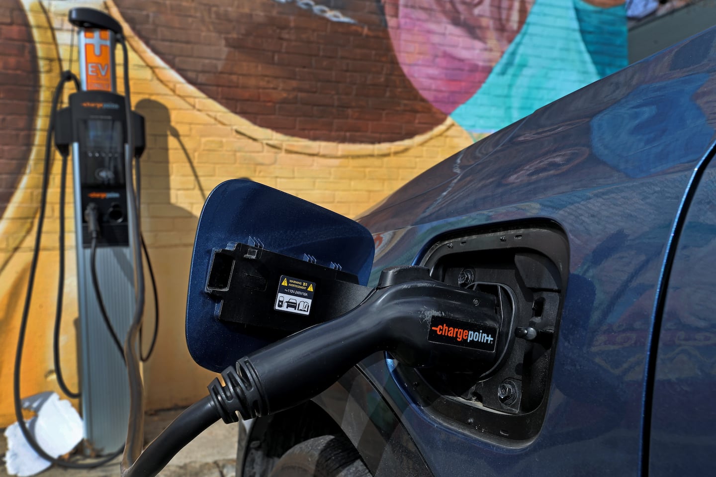 A view of a CHARGEPOINT EV Charger at Bishop Richard Allen Drive in a Cambridge, Mass., parking lot.