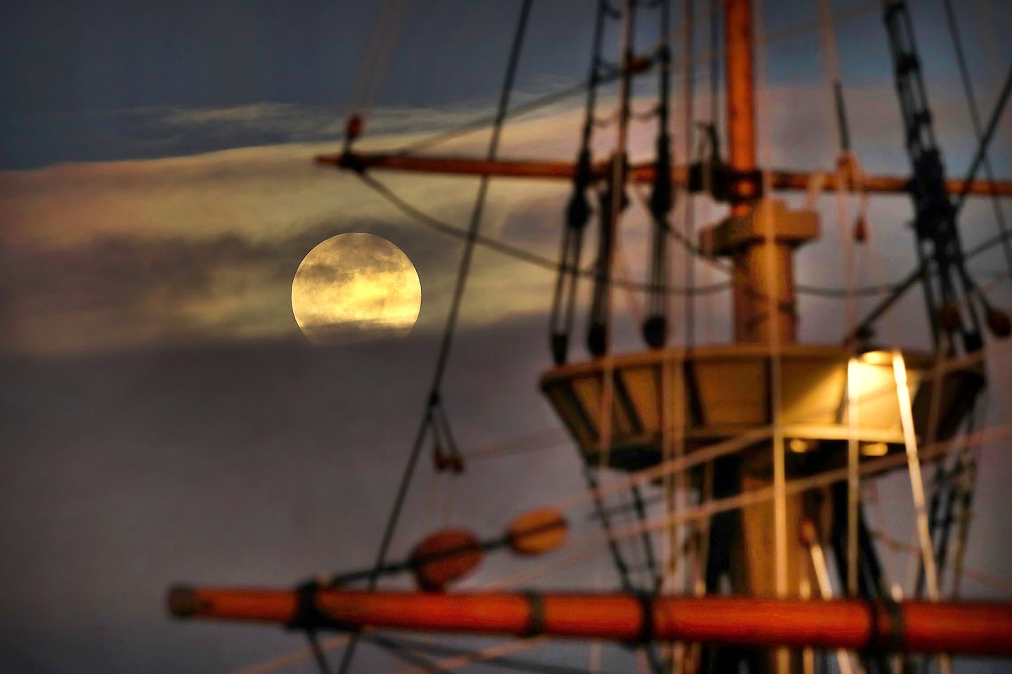 The last supermoon of the year, the beaver moon, rose over the rigging of the Mayflower ll ship in Plymouth Harbor Friday evening.