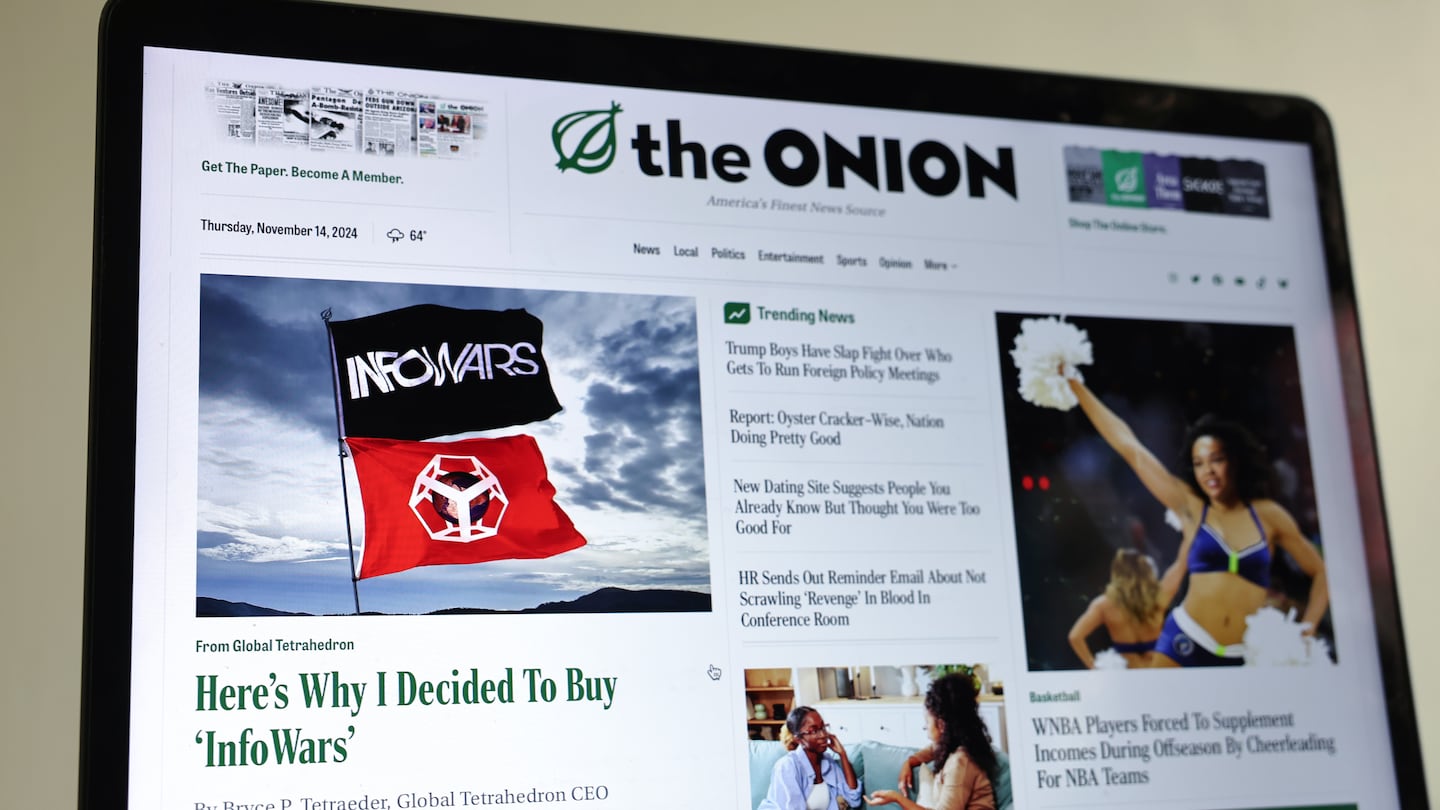 In this photo illustration, The Onion home page is displayed on a computer screen, showing a satirical story.