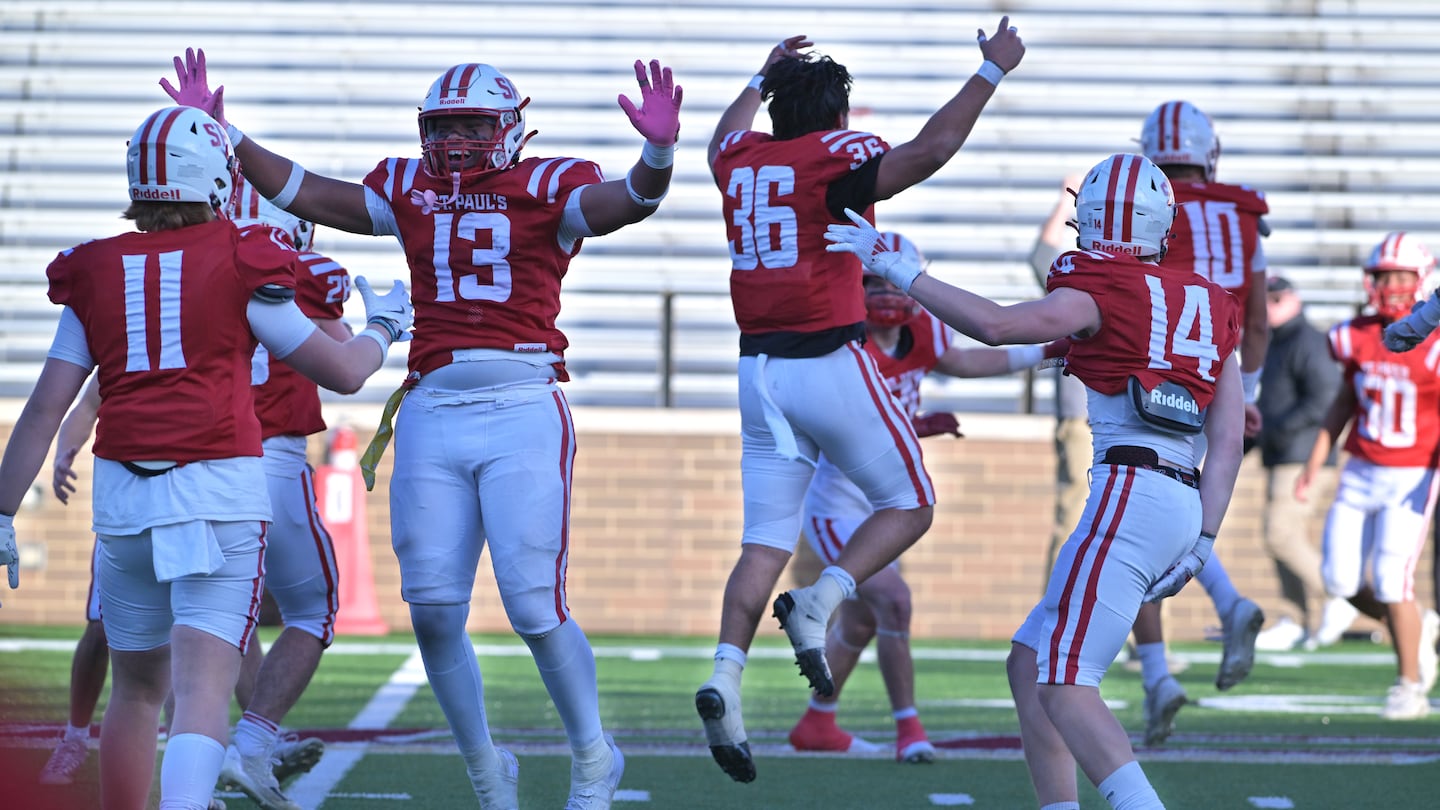 St. Paul's School players celebrate an undefeated season after knocking off previously unbeaten BB&N in the NEPSAC John Papas Bowl at Boston College's Alumni Stadium.