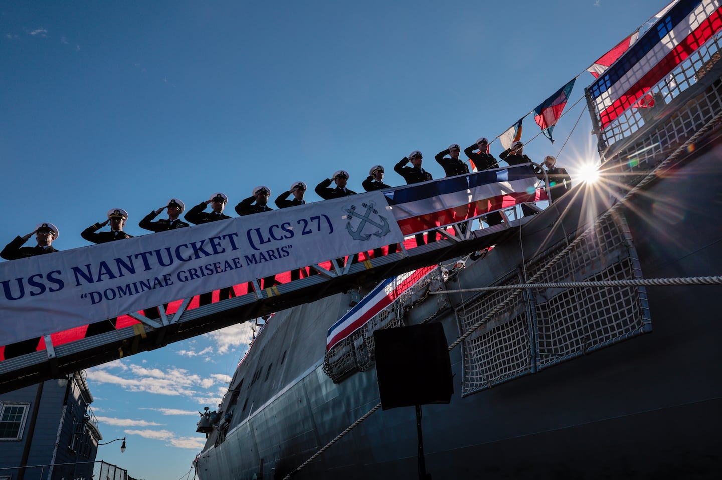 Crew members saluted after the commissioning of the USS Nantucket during a ceremony at the Charlestown Navy Yard.