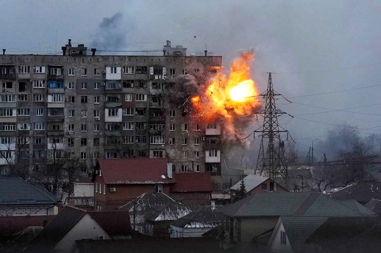 An explosion in an apartment building after a Russian army tank fires in Mariupol, Ukraine, on March 11, 2022.