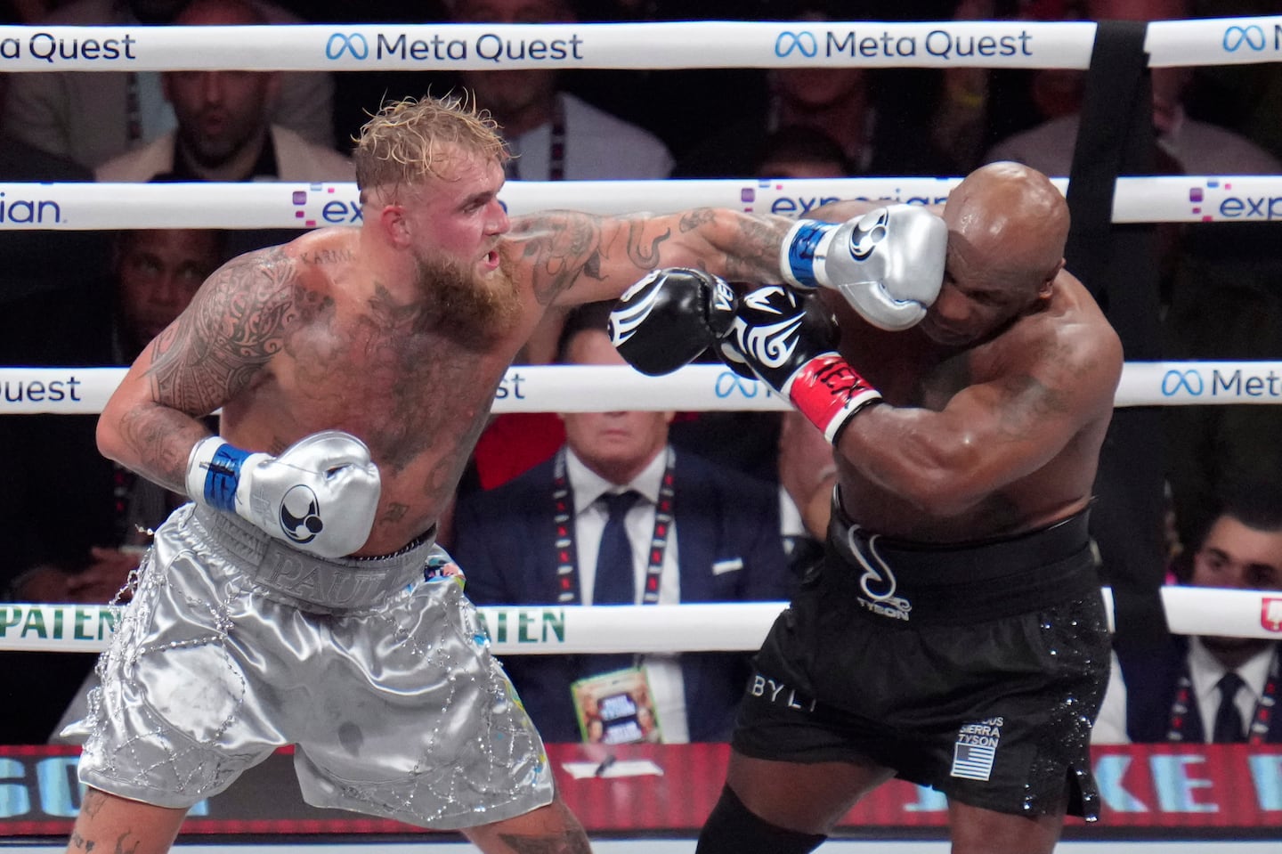 Jake Paul lands a left to Mike Tyson during their heavyweight boxing match that reached about 65 million viewers on Friday.