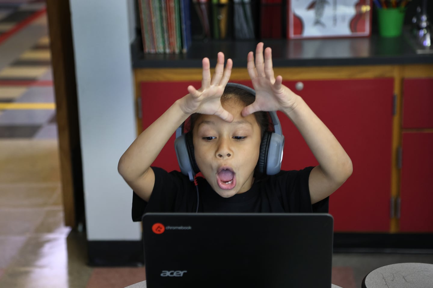 At the Frank M. Sokolowski Elementary School in Chelsea, Raelynn Ruiz reacted to her reading tutors on her computer during class.