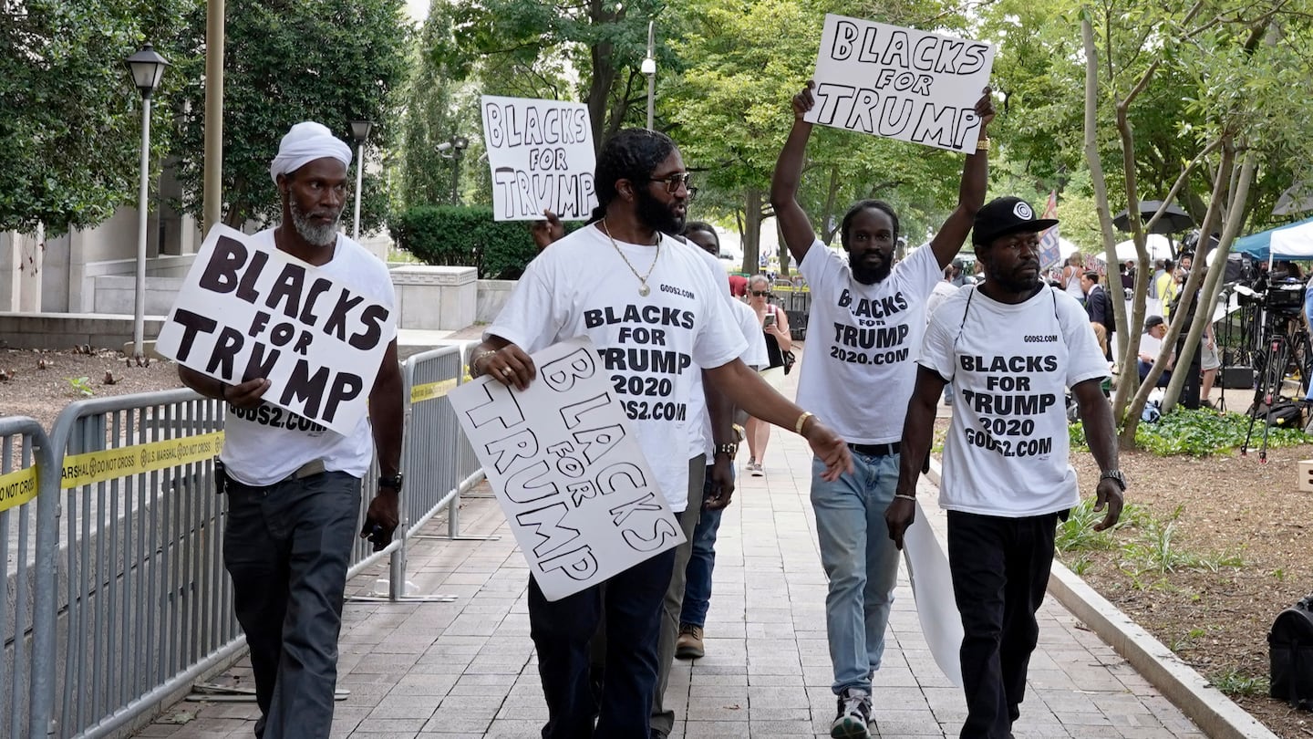 Supporters of Donald Trump with signs and T-shirts that read "Blacks for Trump" marched in Washington D.C. in 2023.