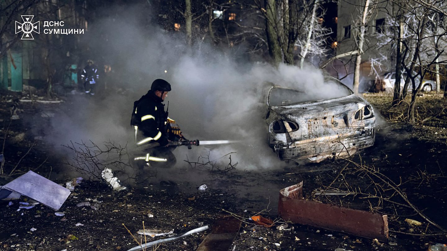 In this photo provided by the Ukrainian Emergency Service, firefighters extinguish the fire following a Russian rocket attack that hit a multi-storey apartment building in Sumy, Ukraine, on Nov. 17.