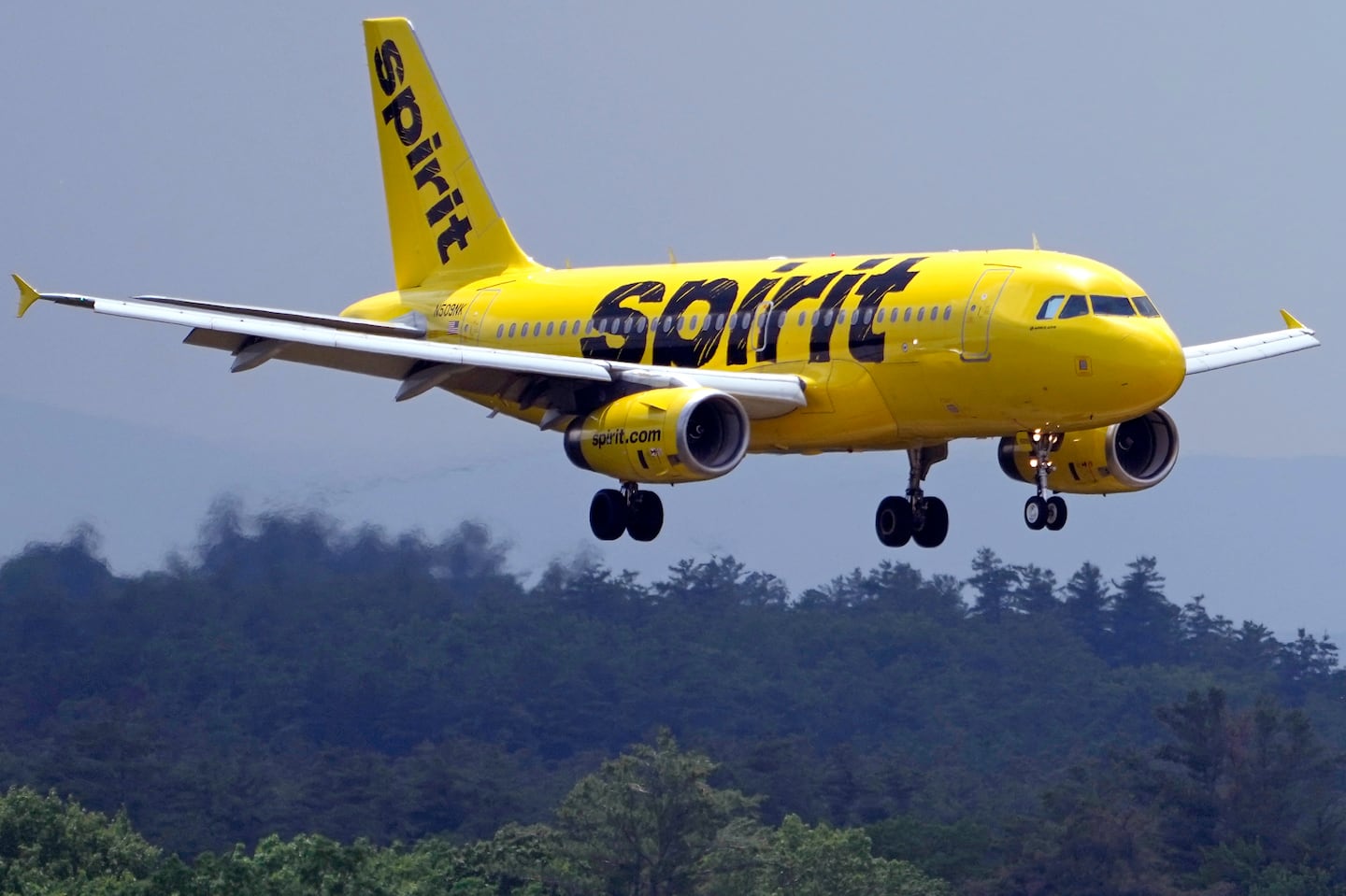 A Spirit Airlines 319 Airbus approaches Manchester Boston Regional Airport for a landing,