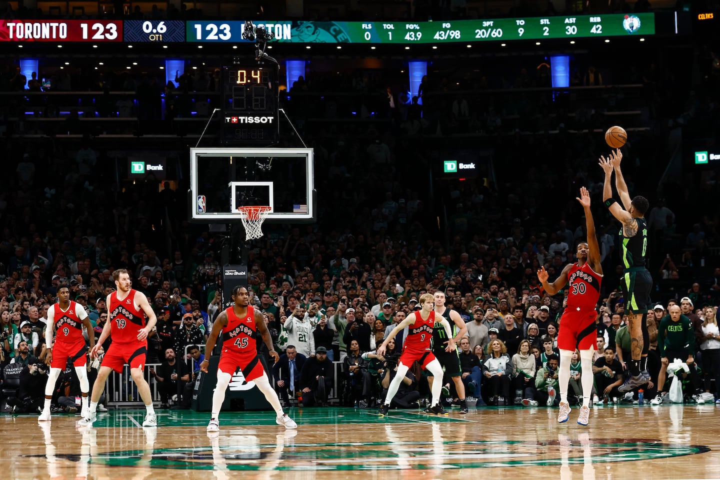 Jayson Tatum (far right) hit a 3-pointer as the clock expired in overtime Saturday at TD Garden.