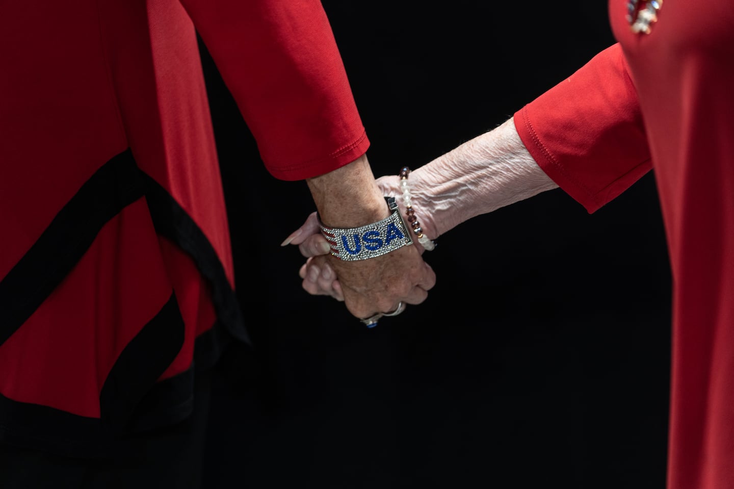 Supporters of Donald Trump held hands while arriving at a campaign rally in Prescott Valley, Ariz., on Oct. 13.