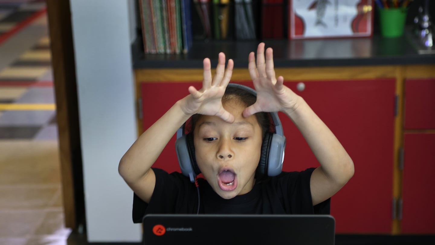 At the Frank M. Sokolowski Elementary School in Chelsea, Raelynn Ruiz reacted to her reading tutors on her computer during class.