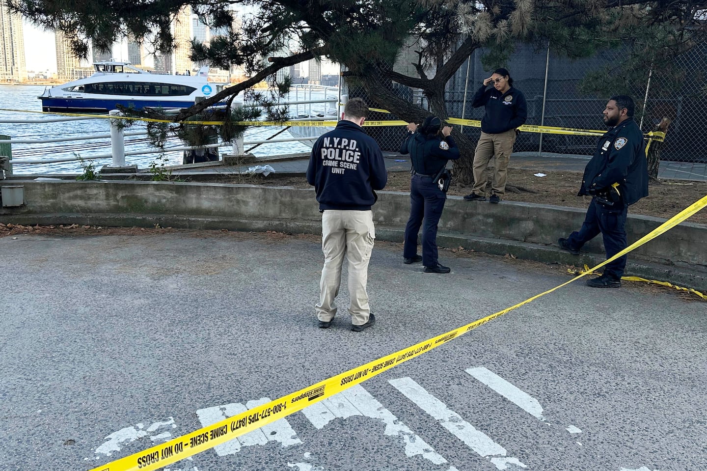 Yellow crime scene tape surrounded New York City Police Department officers as they work at the scene of a stabbing in New York on Monday.