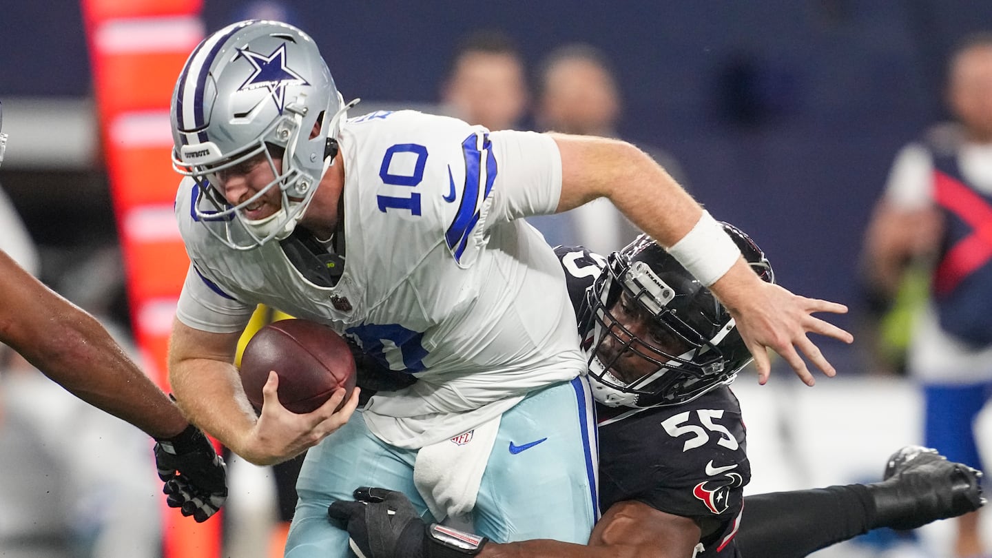 Quarterback Cooper Rush and the Cowboys were shut out in the second half on Monday, with Danielle Hunter (right) scoring two of Houston's five sacks.